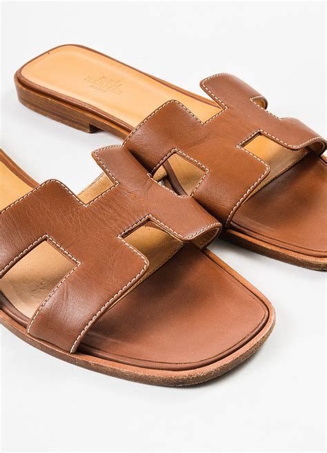 brown hermes oran sandals.